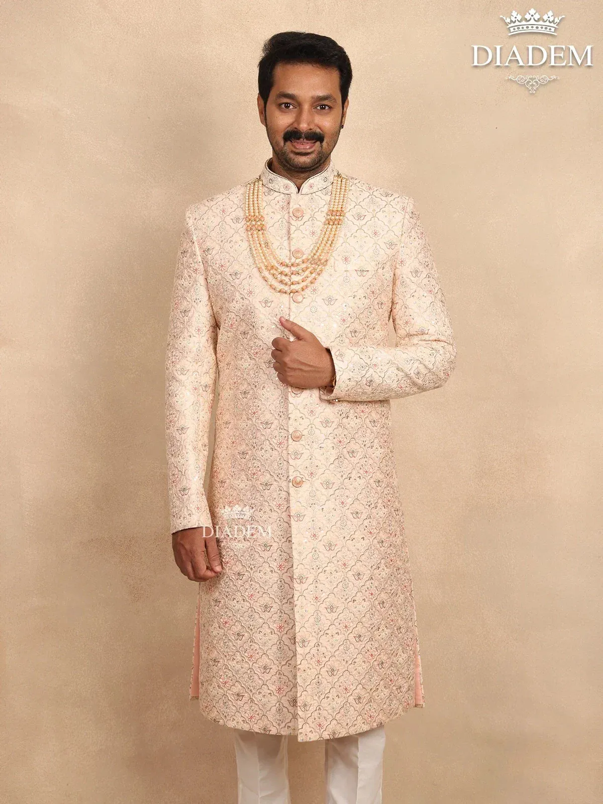 Cream Raw Silk Sherwani Suit with Floral Threadwork Embroidery, Paired with Bead Mala